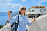 a woman recording a UGC video in Greece