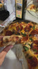 Eating Pepperoni Pizza at a restaurant