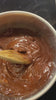 Stirring a pot of melted chocolate