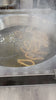 Spanish Churros Being Fried in sizzling oil - Mobile-Shot Vertical Video (HD, 9:16)