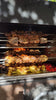 Rotisserie chicken on mass - Mobile-Shot Stock Video, Portrait (HD, 9:16)